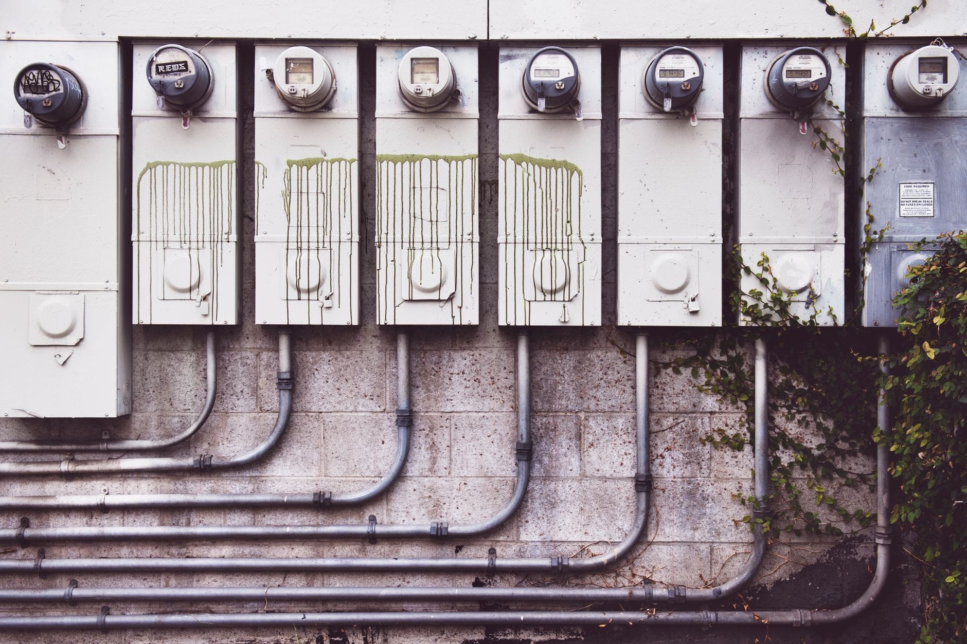 Array of outdoor electric meters on a brick wall with vines. — google maps mcp server mcp server setup guide