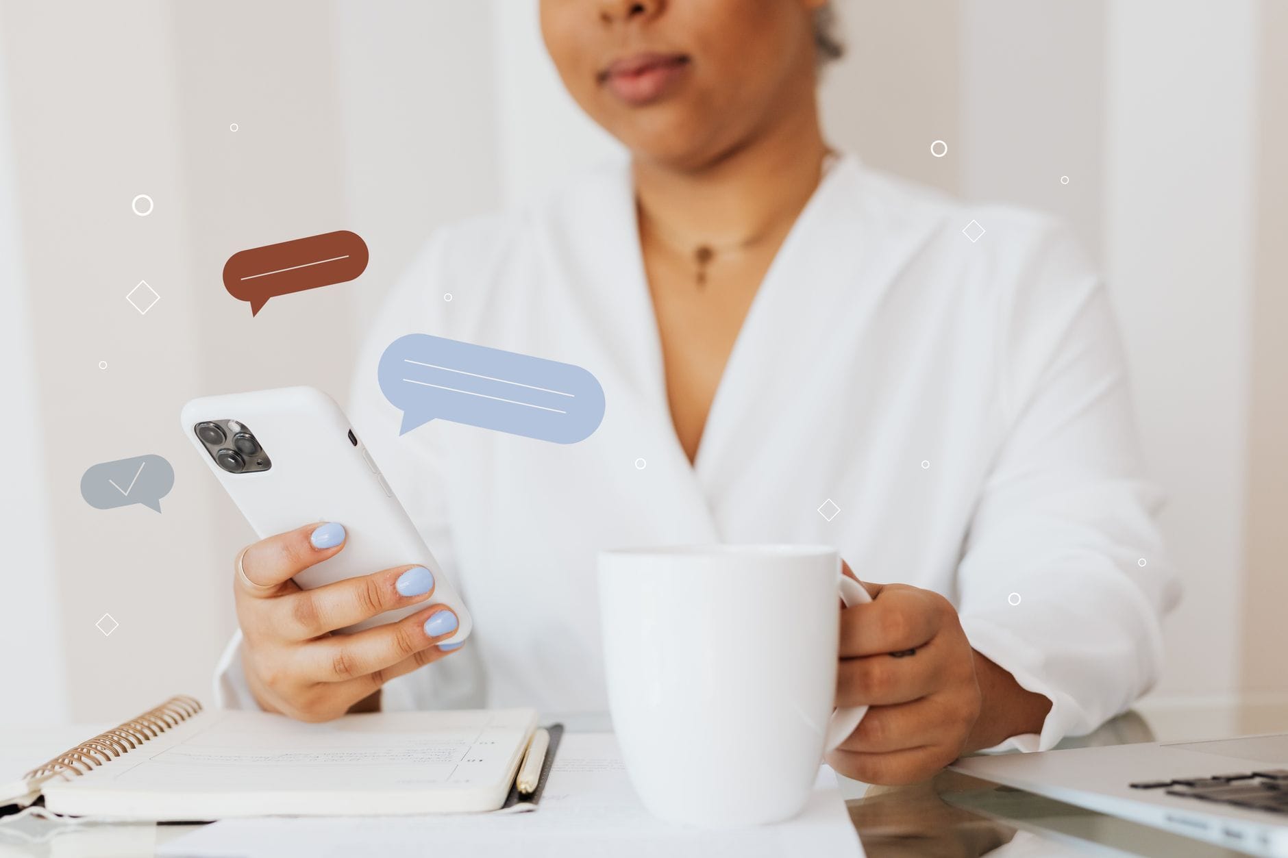 Close-up of a person using a smartphone while holding a coffee cup, showcasing digital communication. — manychat review 