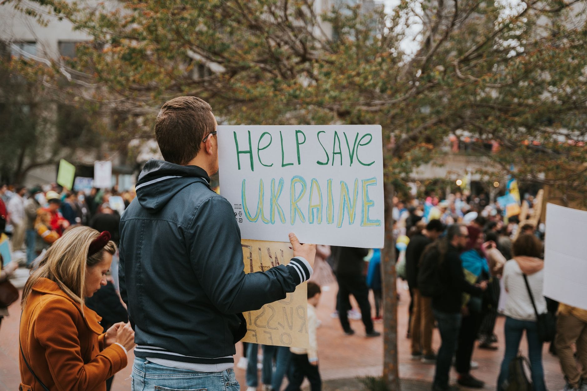 A peace rally in San Francisco with protesters holding signs supporting Ukraine. — anthropic claude app store number one