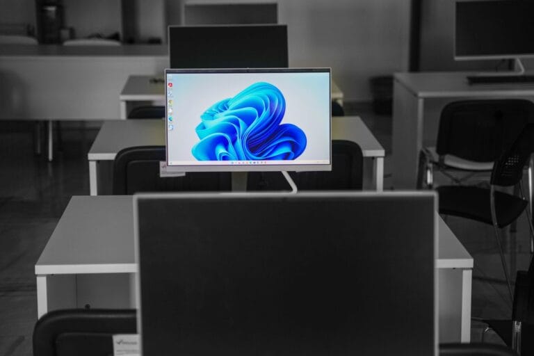 A contemporary office setup featuring computers on desks with modern flat screens. — openai super app codex browser chat