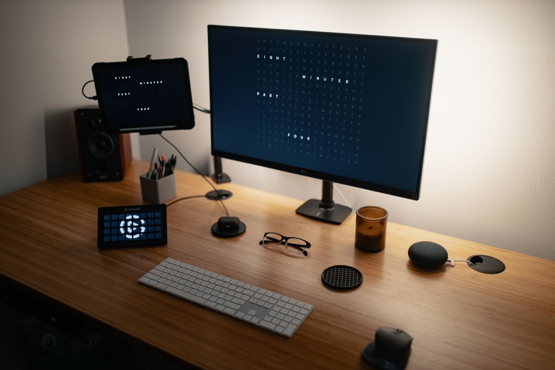 From above of flat screen computer and keyboard placed on wooden table with modern gadgets and monitors in workspace — n